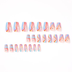 Long coffin press-on nails featuring colorful wave patterns, flowers, and rhinestones