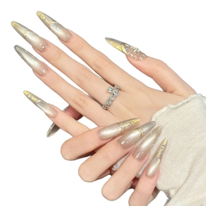 Champagne gold gradient press-on nails with fine diamond accents and golden wire details