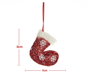Detail view of a 9x8cm red sequin Christmas stocking ornament with white fur trim and snowflake