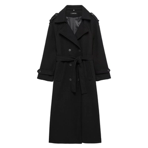 Detailed view of black wool coat with double-breasted buttons, epaulets, and waist belt