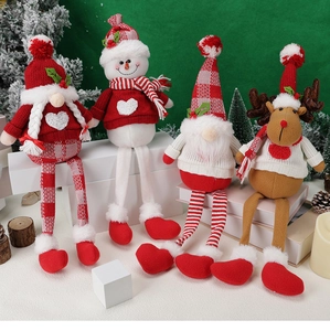 Festive long-legged Christmas gnome and snowman plush dolls arranged on a shelf decoration