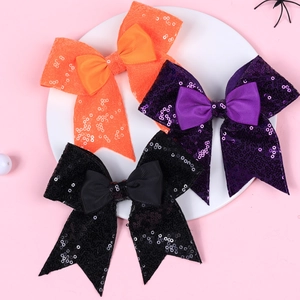 Three-piece sequin bow hair clips set in orange, purple, and black for Halloween