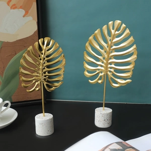 Modern gold monstera leaf metal ornaments with marble base for luxury home decor