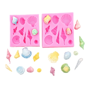Pink silicone mold featuring various sea shell and scallop designs for fondant or chocolate