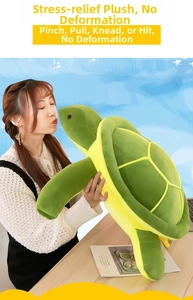 Detailed view of giant green plush sea turtle toy showing large scale and soft fabric