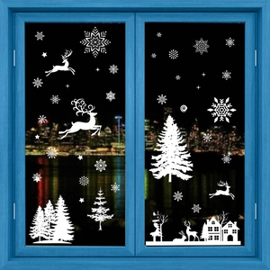 White Christmas window decals with snowflakes, reindeer, and trees on blue glass