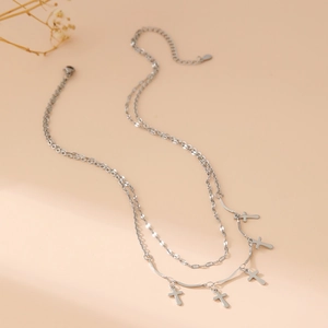 Double-layer stainless steel necklace with five cross pendants on a stylish lip chain