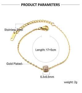 Detail of 18K gold plated stainless steel bracelet with square cubic zirconia charm