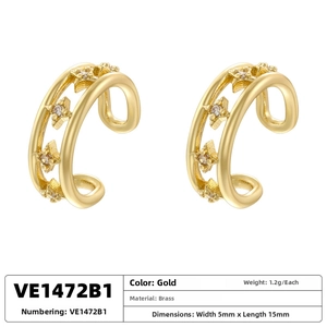 Detailed view of gold plated brass double-layered ear cuff with star and zircon inlay
