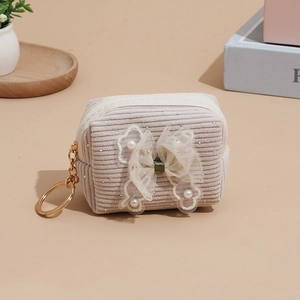 Cute beige corduroy mini coin purse with lace bow, pearls, and golden keychain