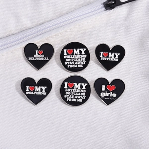 Set of 6 cartoon enamel heart badges with humorous slogans on white canvas bag