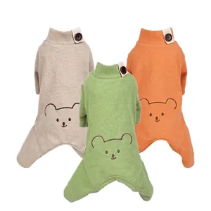 Cozy cartoon bear dog pajamas set in beige, green, and orange soft waffle knit fabric