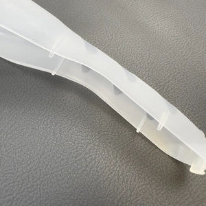 Close-up of a semi-transparent plastic razor storage box with reinforced ribs