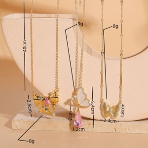 Luxury butterfly necklaces with shell zircon and pink gemstone pendants on stone prop