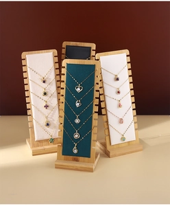 Bamboo necklace display stand featuring multi-slot velvet pads in white and black
