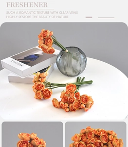 Close-up of artificial orange bouquet in striped vase with realistic petal textures