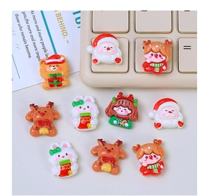Miniature resin Christmas charms featuring Santa and reindeer for DIY handmade hair clips