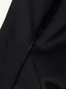 Close-up of high-quality invisible zipper on black satin lace camisole back detailing