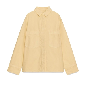 Pale yellow long sleeve shirt with chest pockets and button-down front on white background