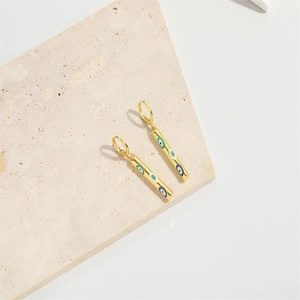 Golden column drop earrings with colorful enamel evil eye charms on natural stone base