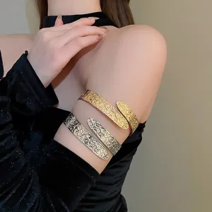 Vintage metal open arm cuff bracelets with floral patterns in gold and silver finish