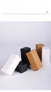 Detail view of premium white, black, and kraft paper lipstick boxes for cosmetic packaging