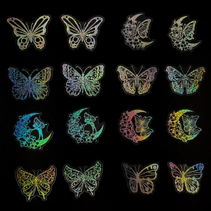 Macro display of holographic butterfly and moon stickers with laser reflective finish
