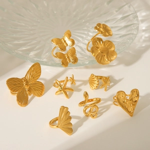 Golden stainless steel rings set featuring butterfly, snake and heart minimalist designs