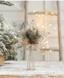 Macro detail of rustic star tree topper with burlap bow and natural pine cones