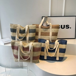 Handwoven straw tote bags in four striped colors for beach vacations and casual use