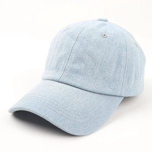 Close-up of light blue denim baseball cap with reinforced stitching and breathable eyelets