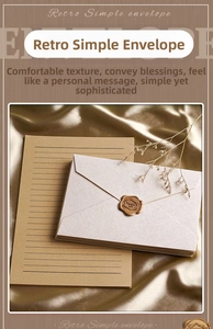 Close-up of linen texture envelope with gold wax seal and lined kraft paper set