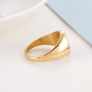 Top-down view showing the highly polished golden finish of this classic signet ring