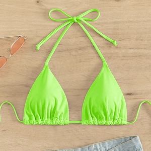 Flat lay detail of a neon green halter bikini top with ruching and adjustable tie strings