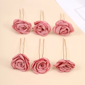 Detail view of six elegant dusty pink fabric rose U-shaped bridal hair pins set