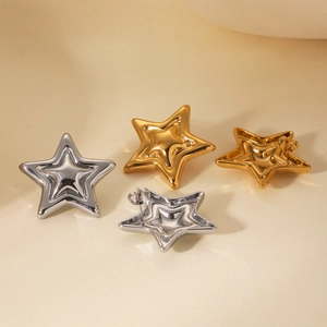 Detail of 3D layered star stud earrings in polished gold and silver stainless steel