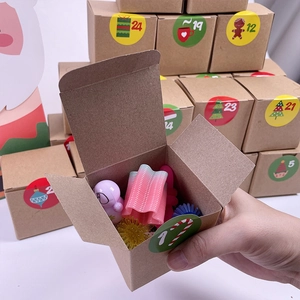 Detail of Christmas advent calendar box featuring numbered stickers and mini surprise toys