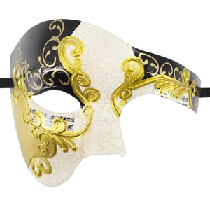 Dettaglio della maschera veneziana con rilievi dorati e trama effetto crepato