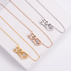 Elegant 520 heart pendant necklaces in gold, rose gold and silver finishes with zircons