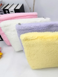 Colorful plush macaron toiletry bags with fluffy texture and metal zipper closure