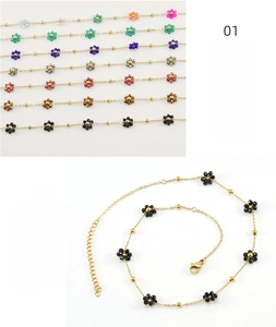 Detail of colorful crystal flower beads on gold stainless steel chain with lobster clasp
