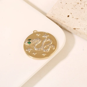 14K gold plated snake medallion pendant with green eye stones and inlaid zircons