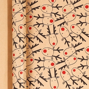 Christmas kraft wrapping paper rolls with red-nosed reindeer patterns for festive gifts