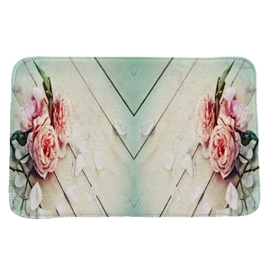 Absorbent flannel rug with symmetrical pink rose pattern on vintage wood print background