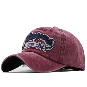 Vintage washed burgundy baseball cap with 3D NY embroidery on white background