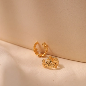 18K gold-plated brass ear cuff featuring a dainty row of daisy flower designs