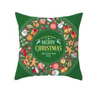 Detail of green Christmas pillow cover featuring Merry Christmas holiday typography