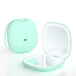 Close-up of mint green LED makeup mirror with Type-C port and touch sensor switch