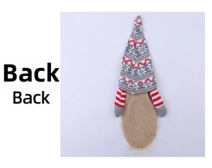 Detailed back view of a knitted Santa gnome wine bottle cover with snowflake patterns