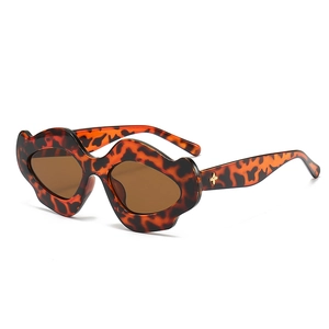 Unique lip-shaped tortoiseshell sunglasses with wavy punk frames for party fashion